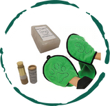 Green pet grooming mitts with a soap bar and bottles on a white background