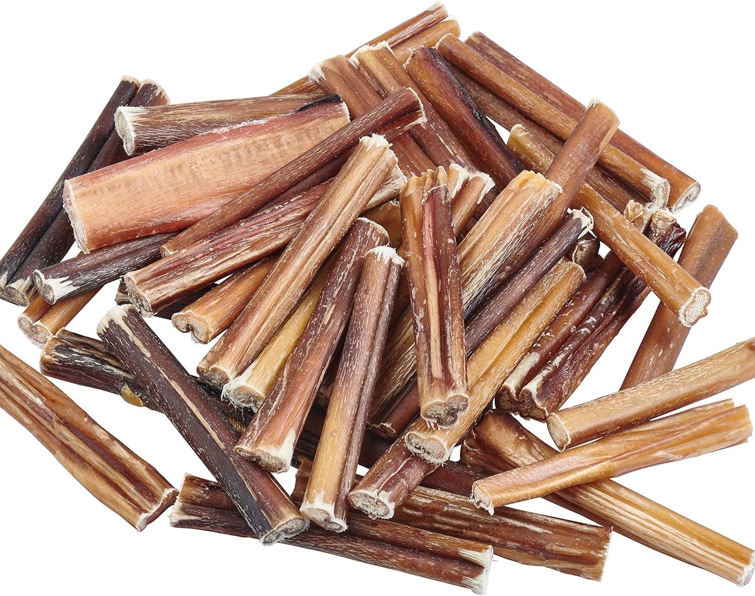 Pile of dog chew sticks on a white background