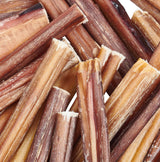 Close-up of dried dog bones with brown and beige hues.