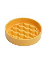 Yellow textured bowl on a white background